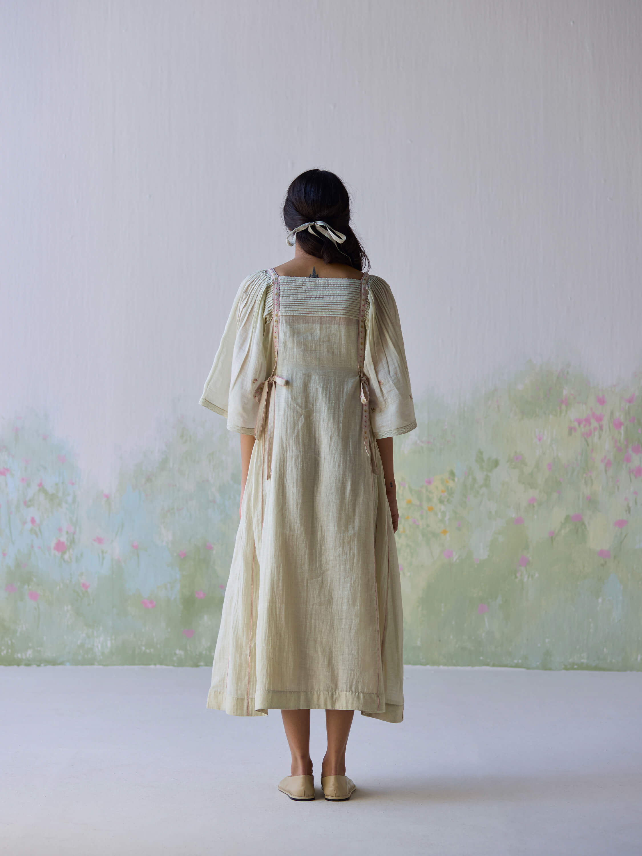 Back view of the Amore Midi Dress, showcasing its flowy design.