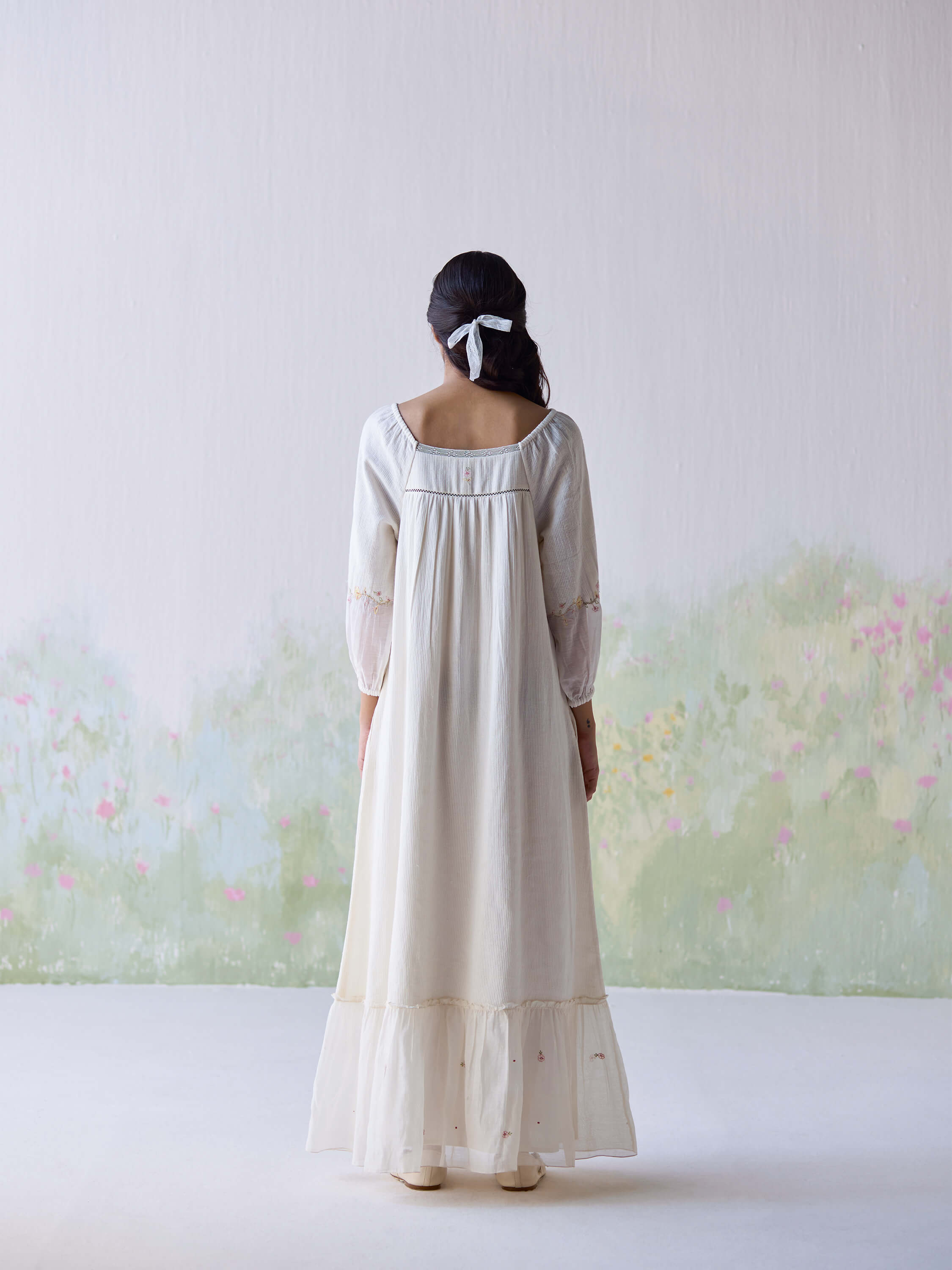 Elegant woman in Belle Maxi Dress, view from back.