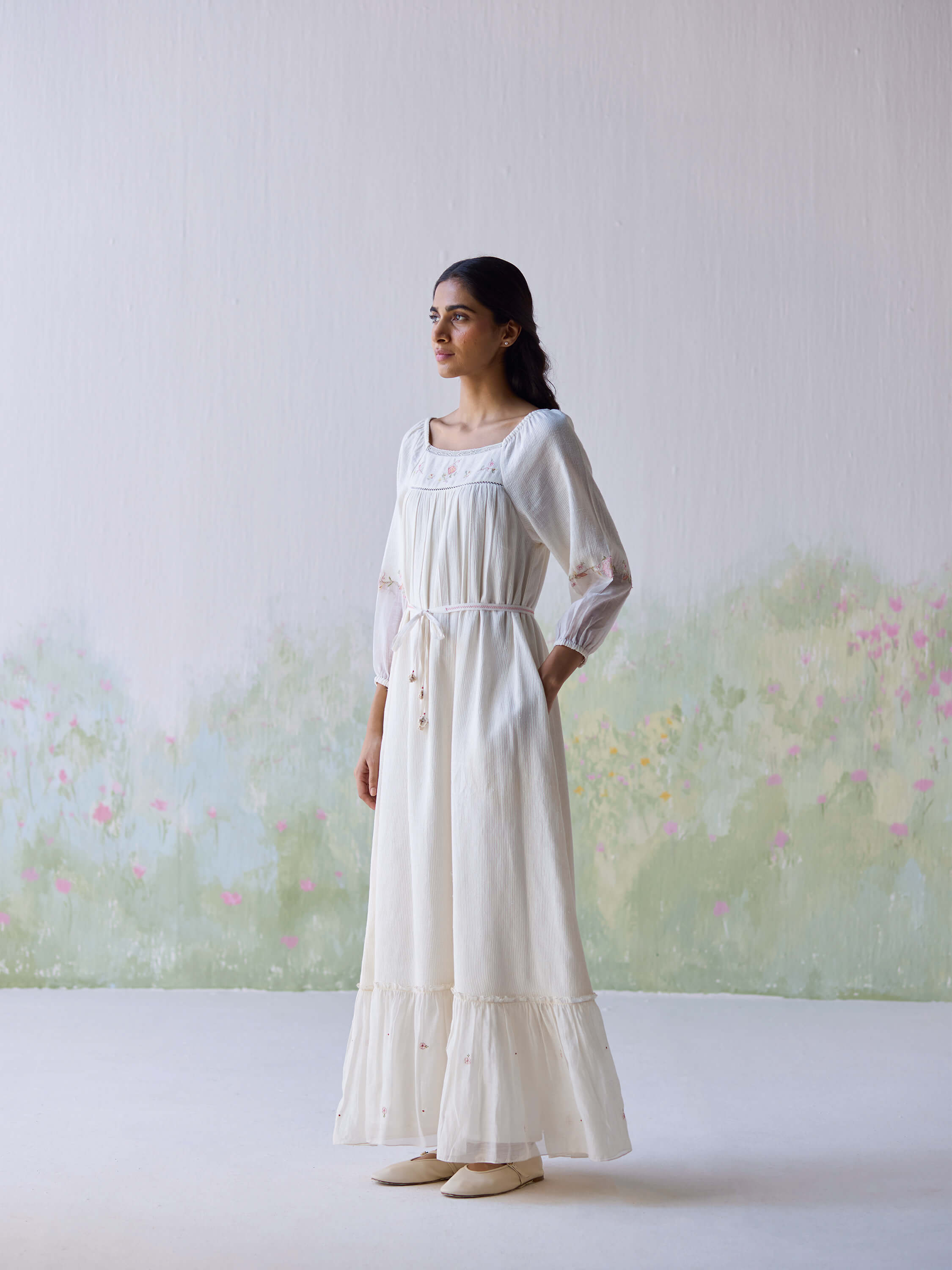 Elegant Belle Maxi Dress on model in serene setting.