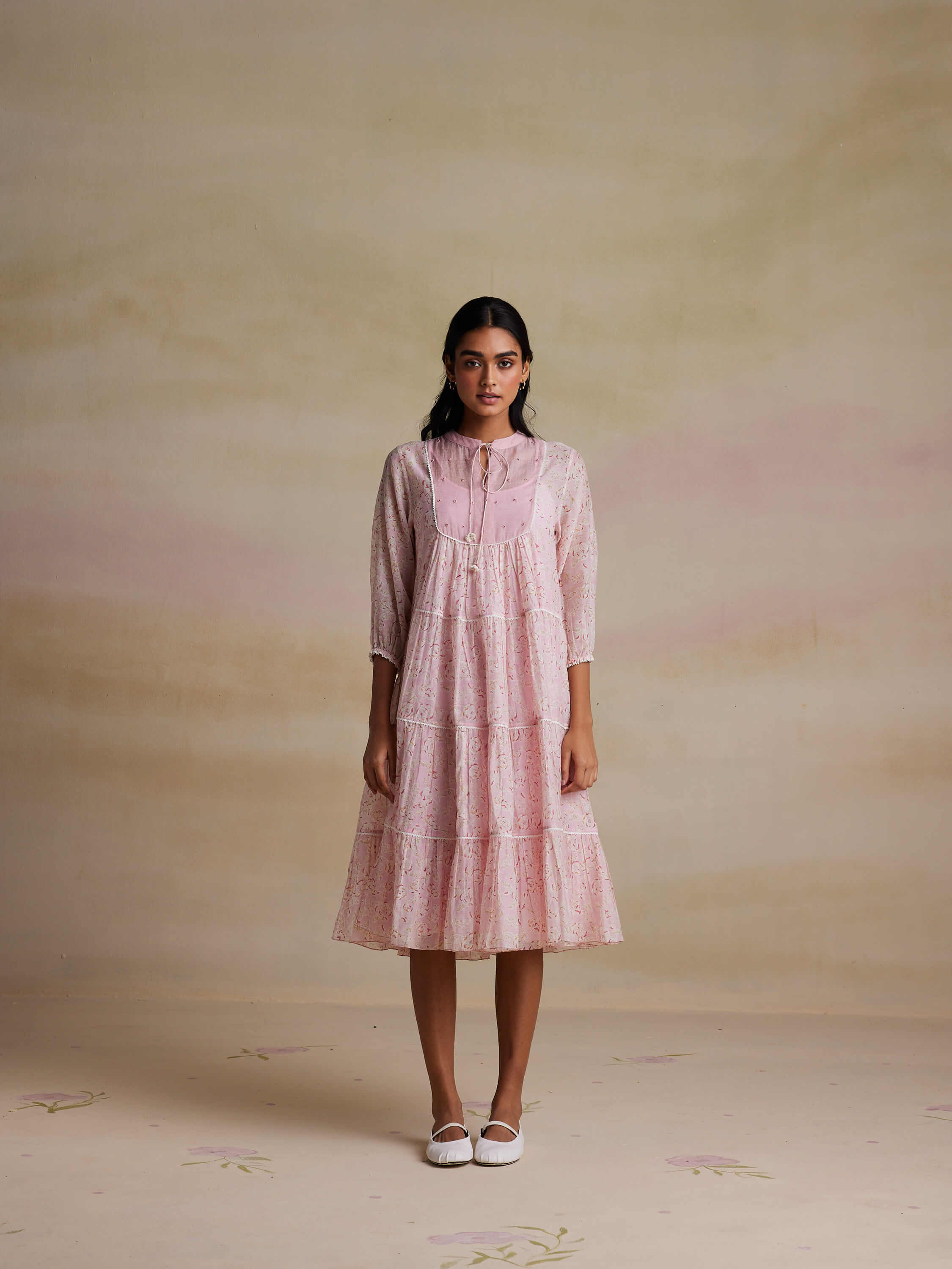 Woman Modeling Pink Floral Long-Sleeve Dress in Studio Photoshoot