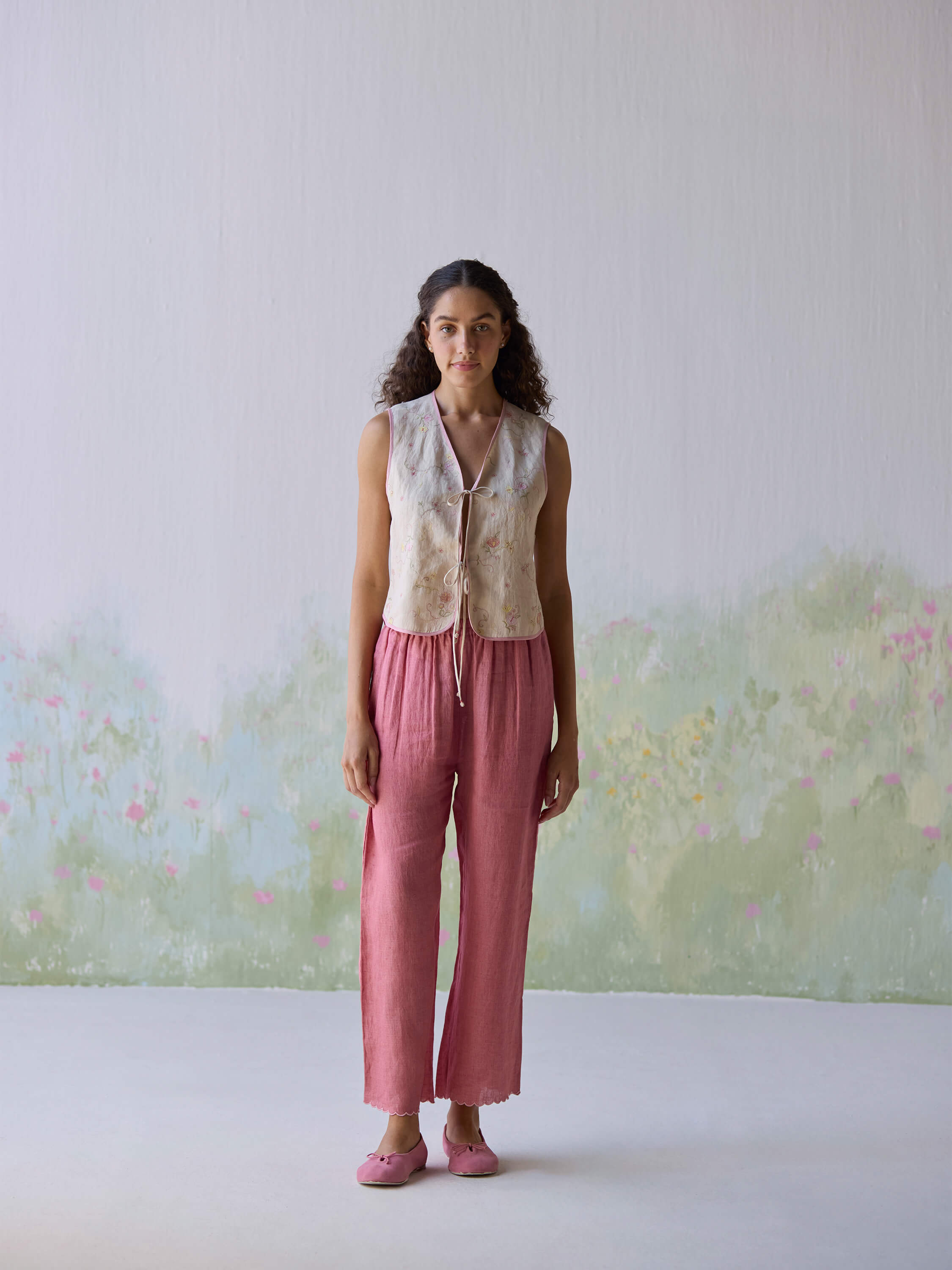 Fanfare Linen Gilet styled with pink pants and matching shoes.