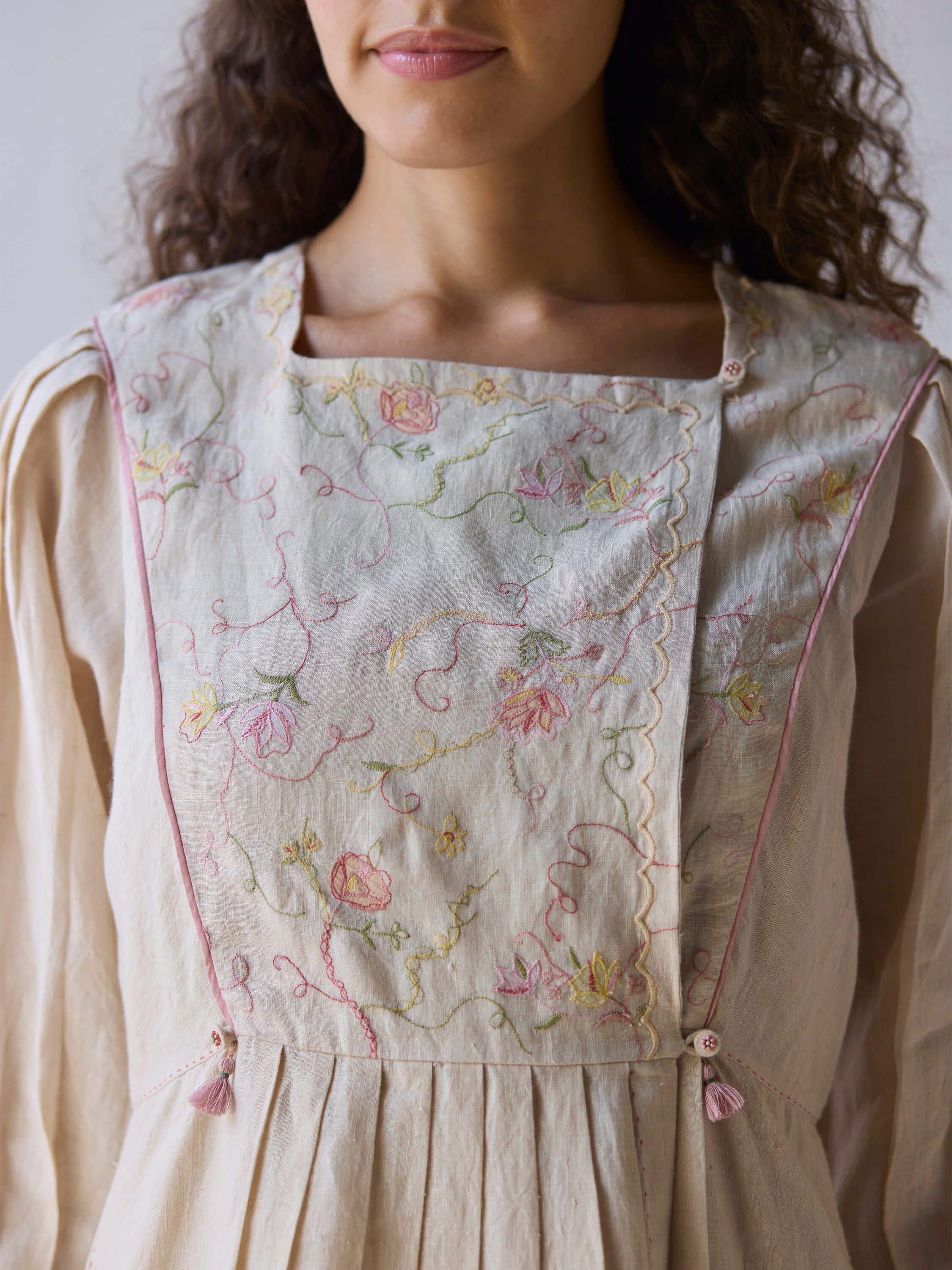 Golden Days Linen Dress with floral embroidery and feminine details.