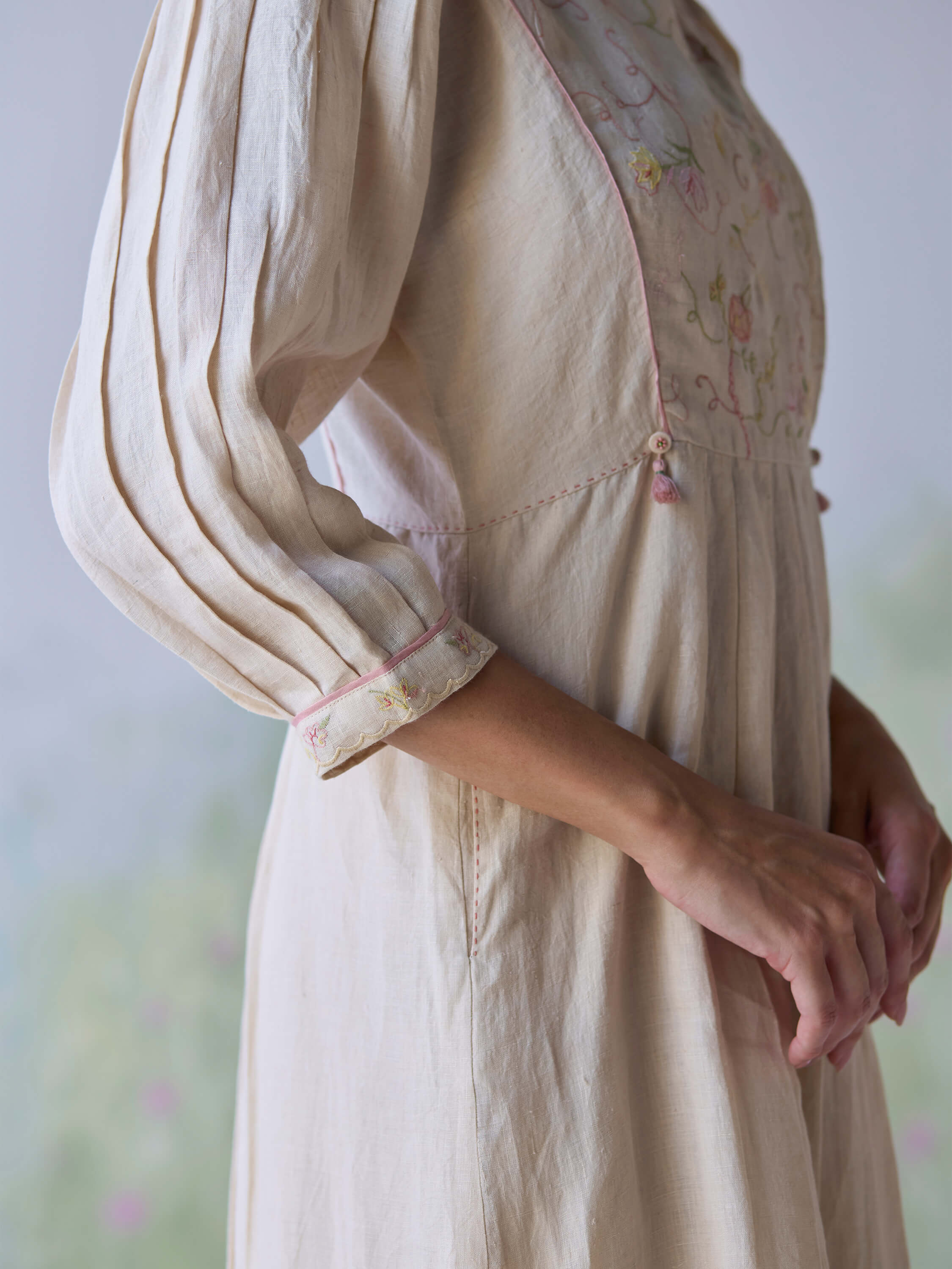 Golden Days Linen Dress showcasing elegant embroidery and delicate sleeves.