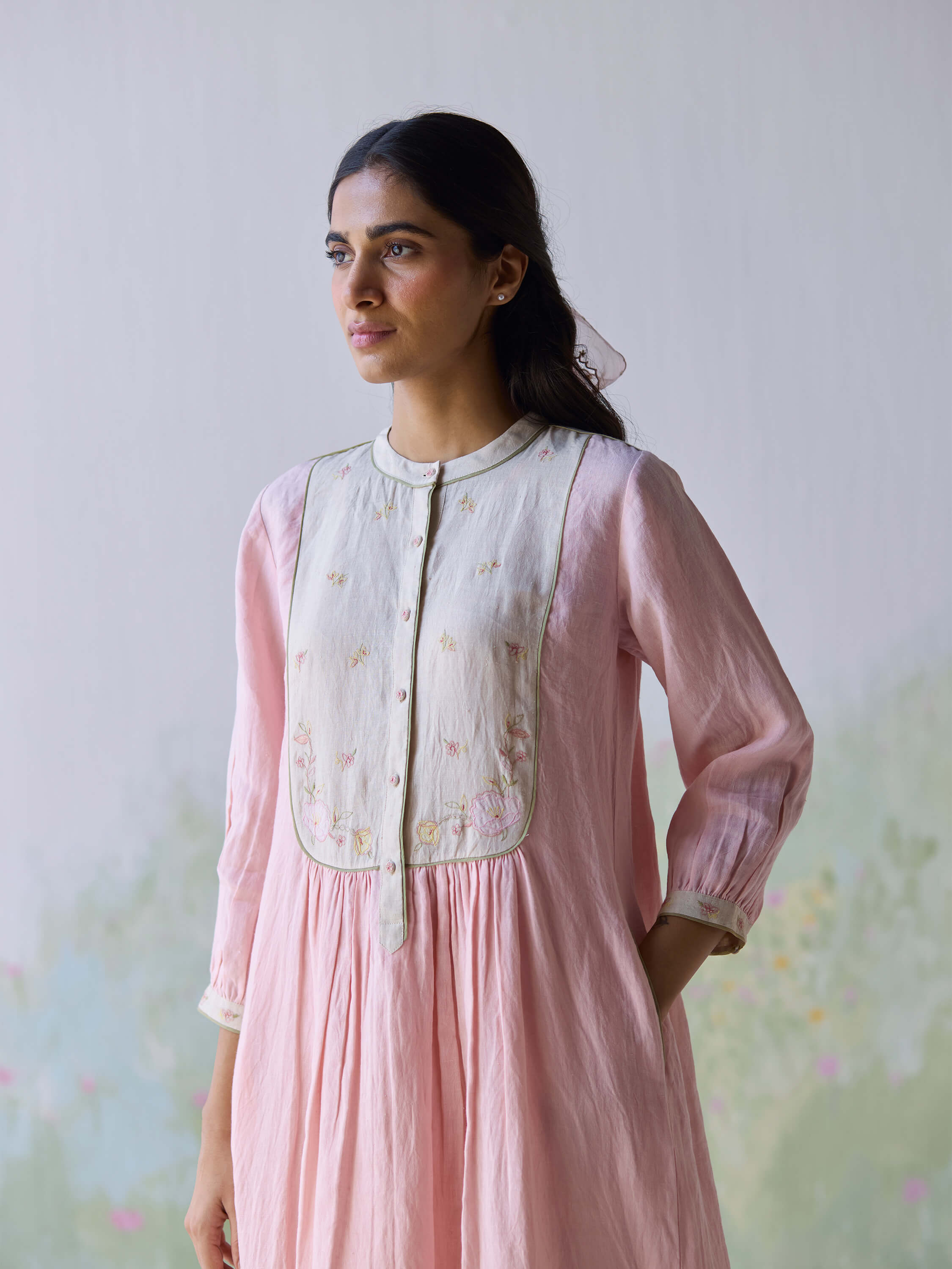 Elegant woman wearing pink In the Moment Linen Dress with embroidery details.