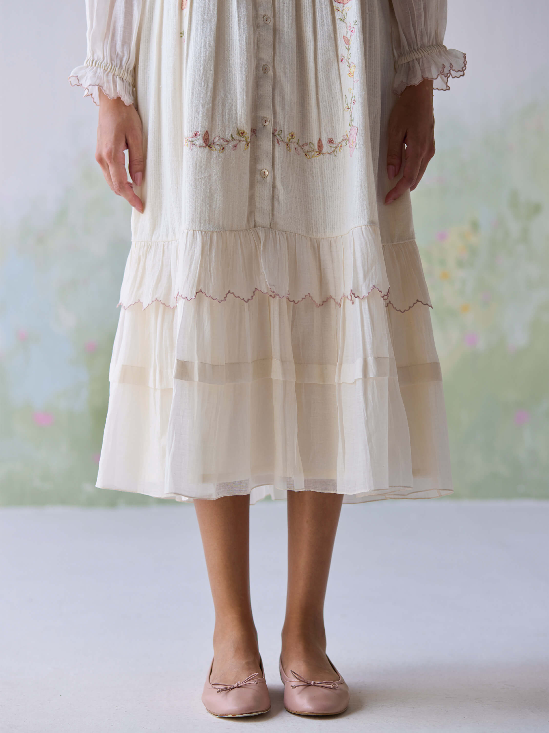 Verona Midi Dress with floral embroidery and delicate layered ruffles.