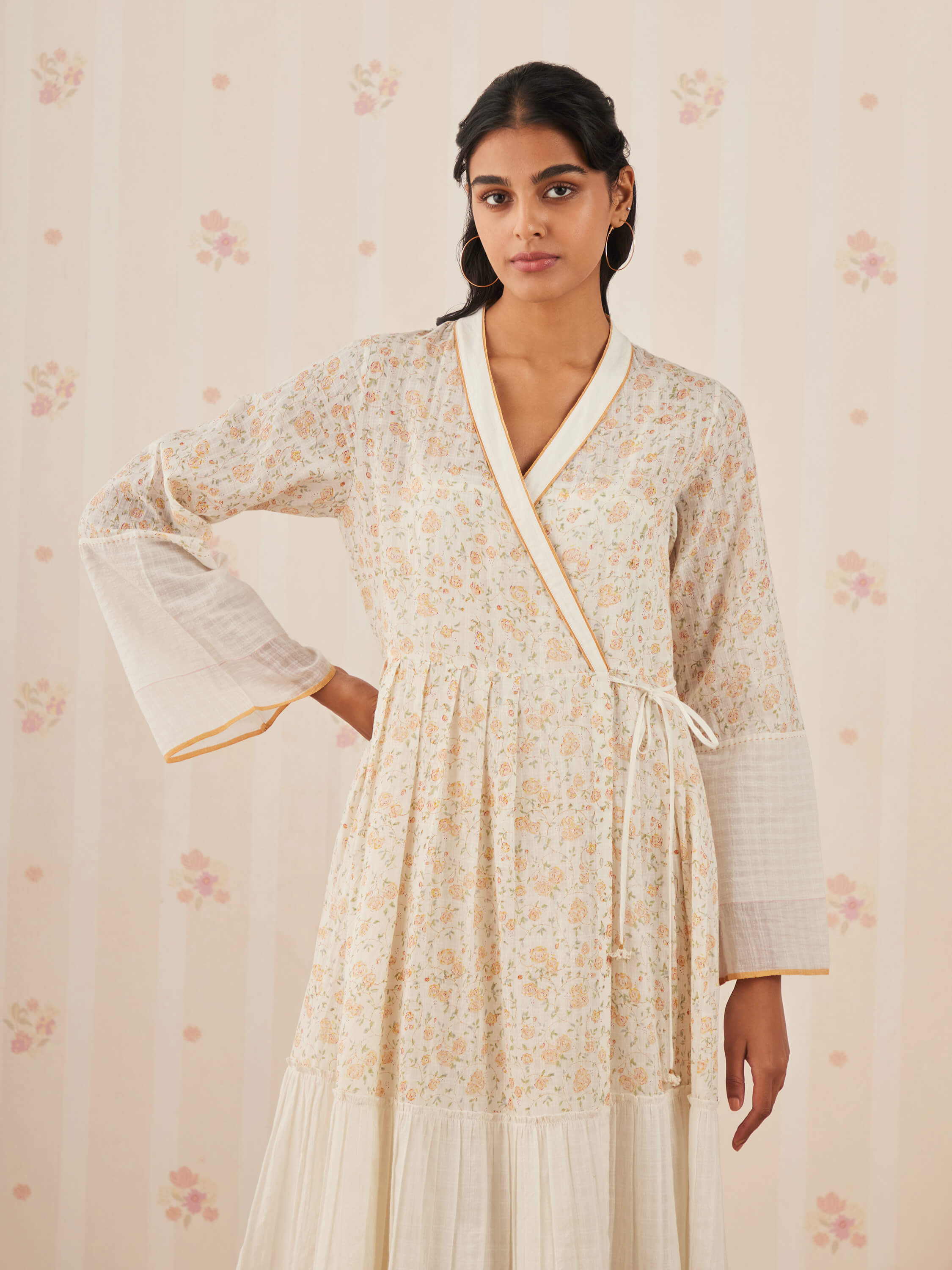 Women's floral print wrap dress with long sleeves in soft hues
